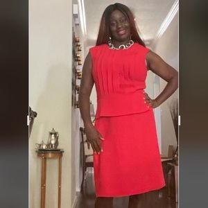 This is a TAHARI Arthur S Levine tomato red peplum dress.